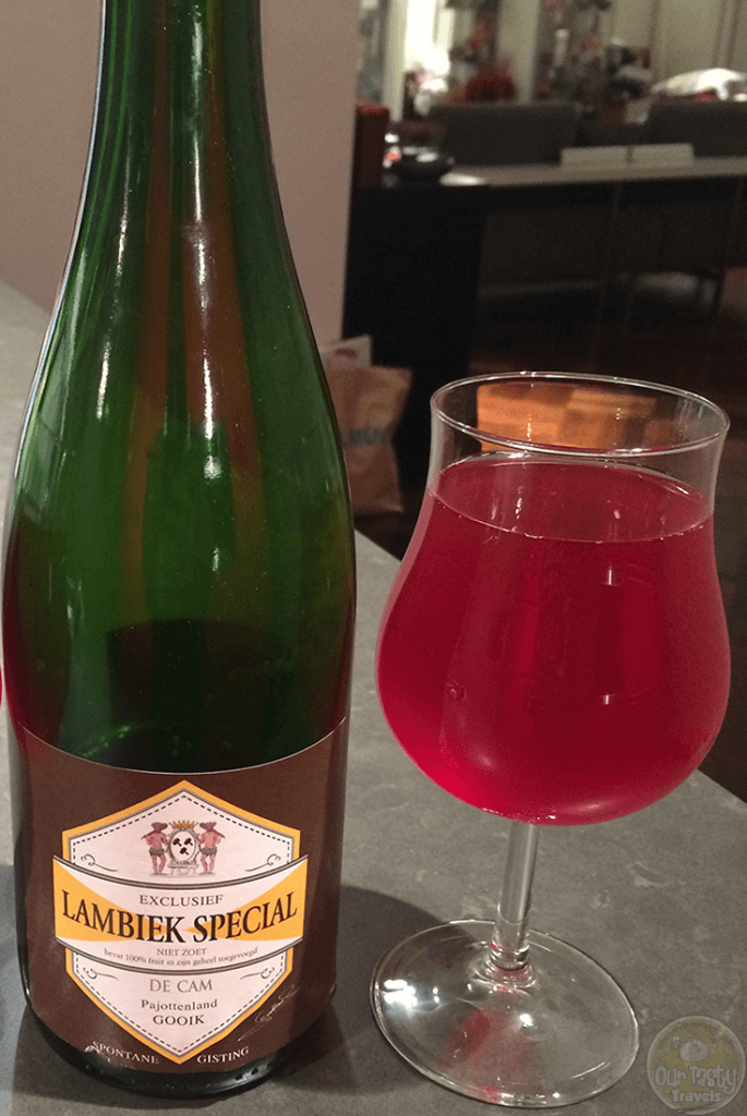 02-Jan-2016: Lambiek Special (2015) by Geuzestekerij De Cam. Sharing this with my brother to help introduce him to Belgian Lambic style beers. This was delicious! Not much pop of the cork, but enough slight fizz in the pour. Beautiful red color, even though not a Kriek. A funky and slightly fruity aroma. The sour base is delightful, with the absorbed berries giving a great fruit flavor. Gooseberries, Blackberries, and sour cherries. #ottbeerdiary