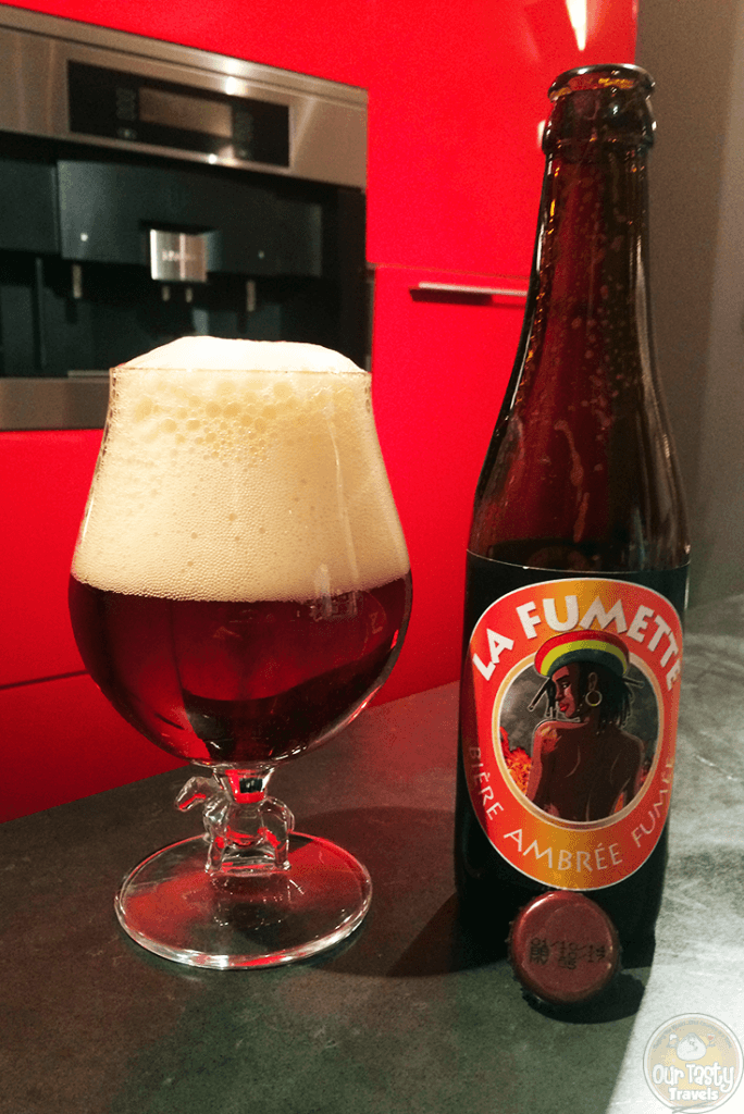 25-Jan-2016: La Fumette by Brasserie Artisanale Millevertus from Breuvanne in the Luxembourg region of Belgium. 7% ABV, 33 cl bottle. A smokey amber beer. Smokey aroma. And a smokey / bitter flavor. Quite a lot of carbonation, and a ton of head. #ottbeerdiary