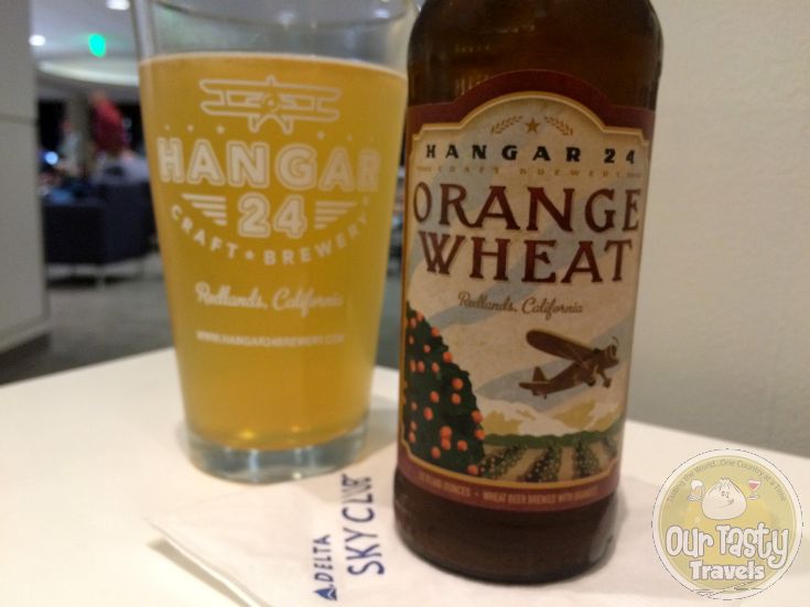 2-Mar-2015 : Orange Wheat by Hangar 24 Craft Brewery : Crisp, Tangy, and Refreshing. The citrus aroma, light airy mouthfeel, and tangy finish are this unfiltered beer’s trademarks. This is accomplished by adding whole locally grown oranges throughout the brewing process, which perfectly coalesce with the wheat and barley base. Our oranges are purchased through the Old Grove Orange company (affiliate of the non-profit Inland Orange Conservancy) whose main objectives are to save the local orange trees from disappearing, spread the word about the local citrus growing heritage, and to feed the hungry with the unutilized oranges. Please visit them at www.inlandorange.org. All we need to do to save the orange trees is to eat or drink locally grown oranges! #ottbeerdiary